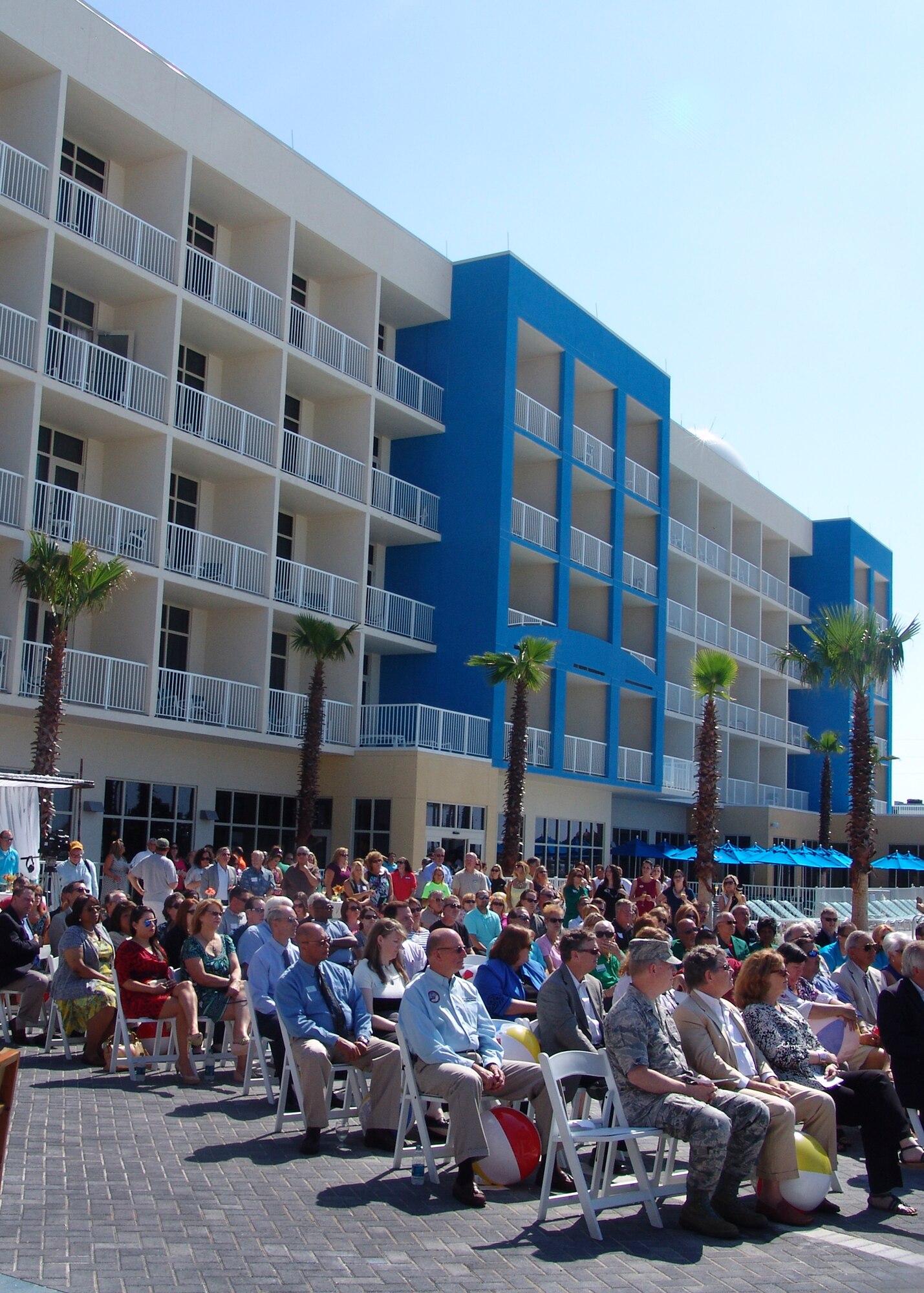 Brig. Gen. David Harris, 96th Test Wing commander and Julian McQueen, CEO and founder of Innisfree Hotels, participate in the opening of the Emerald Breeze Hotel on Okaloosa Island.  A large beach ball on the roof houses test monitoring equipment on a permanent, elevated platform.  The hotel is one of four enhanced-use leasing projects here.  Rent for the use of Air Force land provides  payment-in-kind funds to accomplish facility projects that would otherwise not be funded. Eglin anticipates approximately $190,000 a year in rent from this project. (USAF photo/Lois Walsh) 