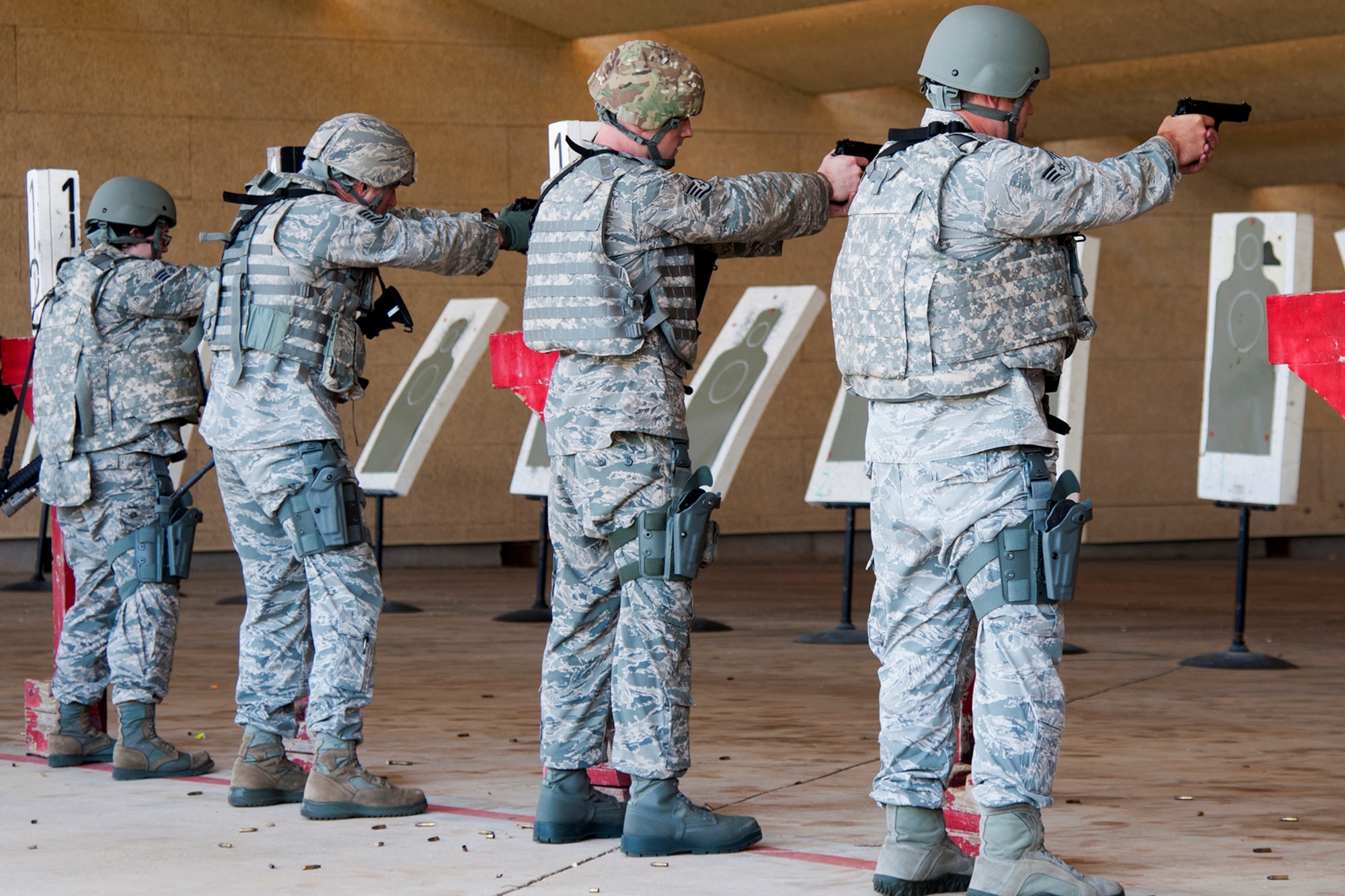 Members of the 307th Security Forces Squadron qualify on 9mm pistols in preparation for a deployment in support of an Eager Lion exercise, May 17, 2014, Barksdale Air Force Base, La. Eager Lion is held in Jordan, and roughly 6,000 U.S. troops will take part in the exercise, which involves more than 12,500 troops from more than 20 countries. (U.S. Air Force photo by 2nd Lt. Monique Roux/Released)