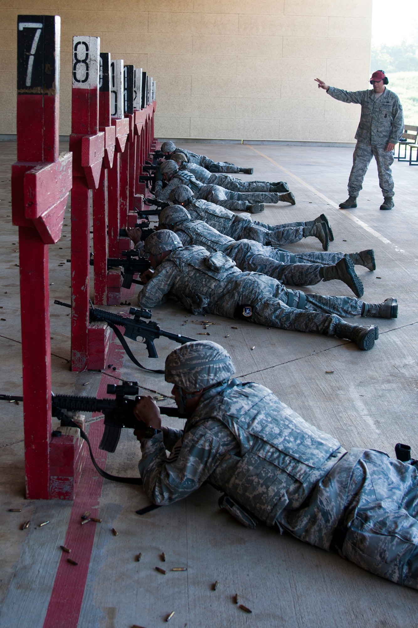 Airmen assigned to the 307th Security Forces Squadron, prepare to fire during weapons qualification training in preparation for a deployment in support of an Eager Lion exercise, May 17, 2014, Barksdale Air Force Base, La. Roughly 6,000 U.S. troops will participate in Eager Lion, which is an exercise involving scenarios ranging from training for a humanitarian assistance to practicing integrated air and missile defense. (U.S. Air Force photo by 2nd Lt. Monique Roux/Released)