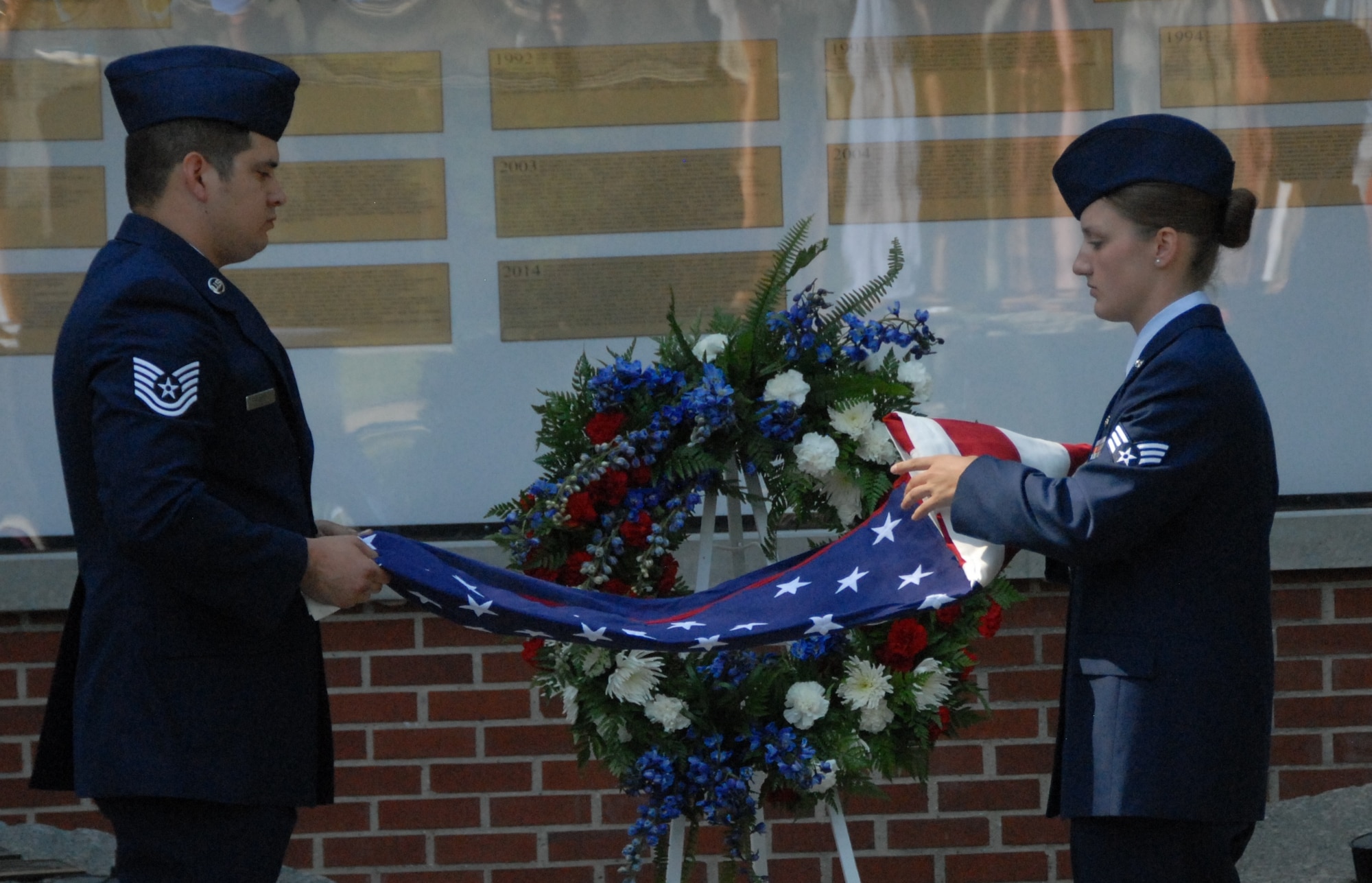 Robins AFB Honor Guard members present the flag during the Camellia Gardens Memorial Service Thursday, May 22.  (U.S. Air Force photo by Misuzu Allen)