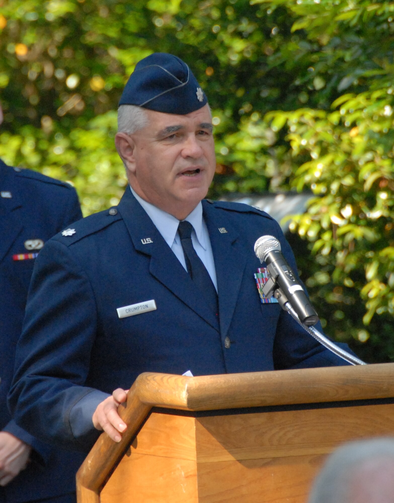 Lt. Col. Mark Crumpton, 78th ABW Chaplain, leads the crowd in a moment of silence in memory of fallen Team Robins members during the Camellia Gardens Memorial Service Thursday, May 22. (U.S. Air Force photo by Misuzu Allen)