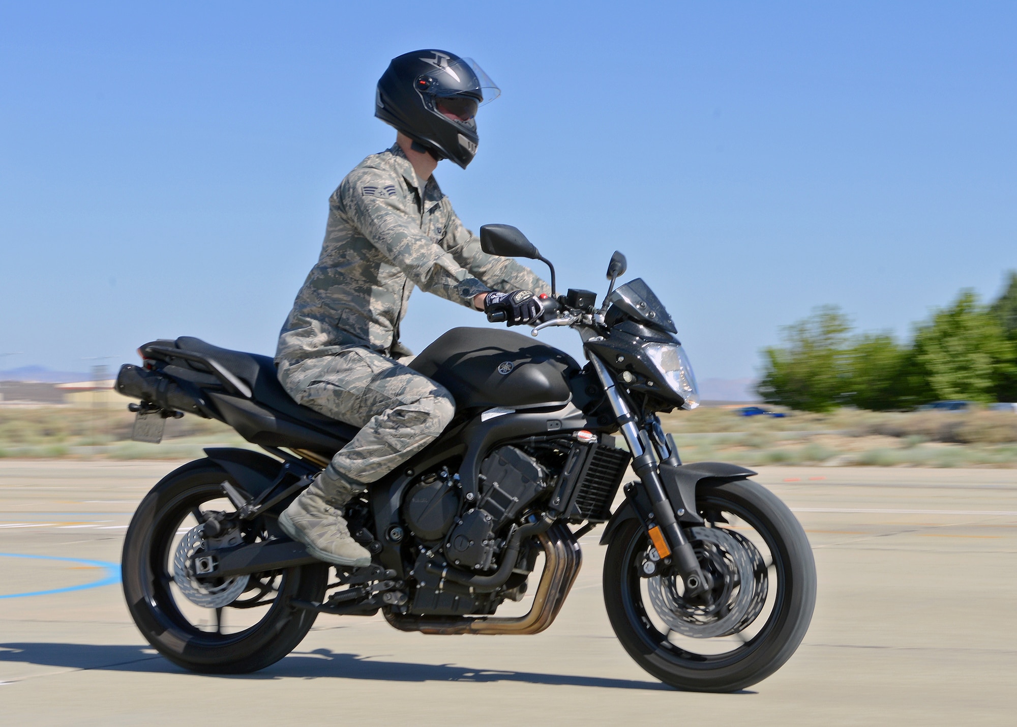 A military sport bike rider goes through a braking training scenario during a sport bike safety class May 14 for military personnel stationed here. The course was brought here in order to help riders sharpen their skills and to teach them how to anticipate problems when riding. (U.S. Air Force photo by Jet Fabara)