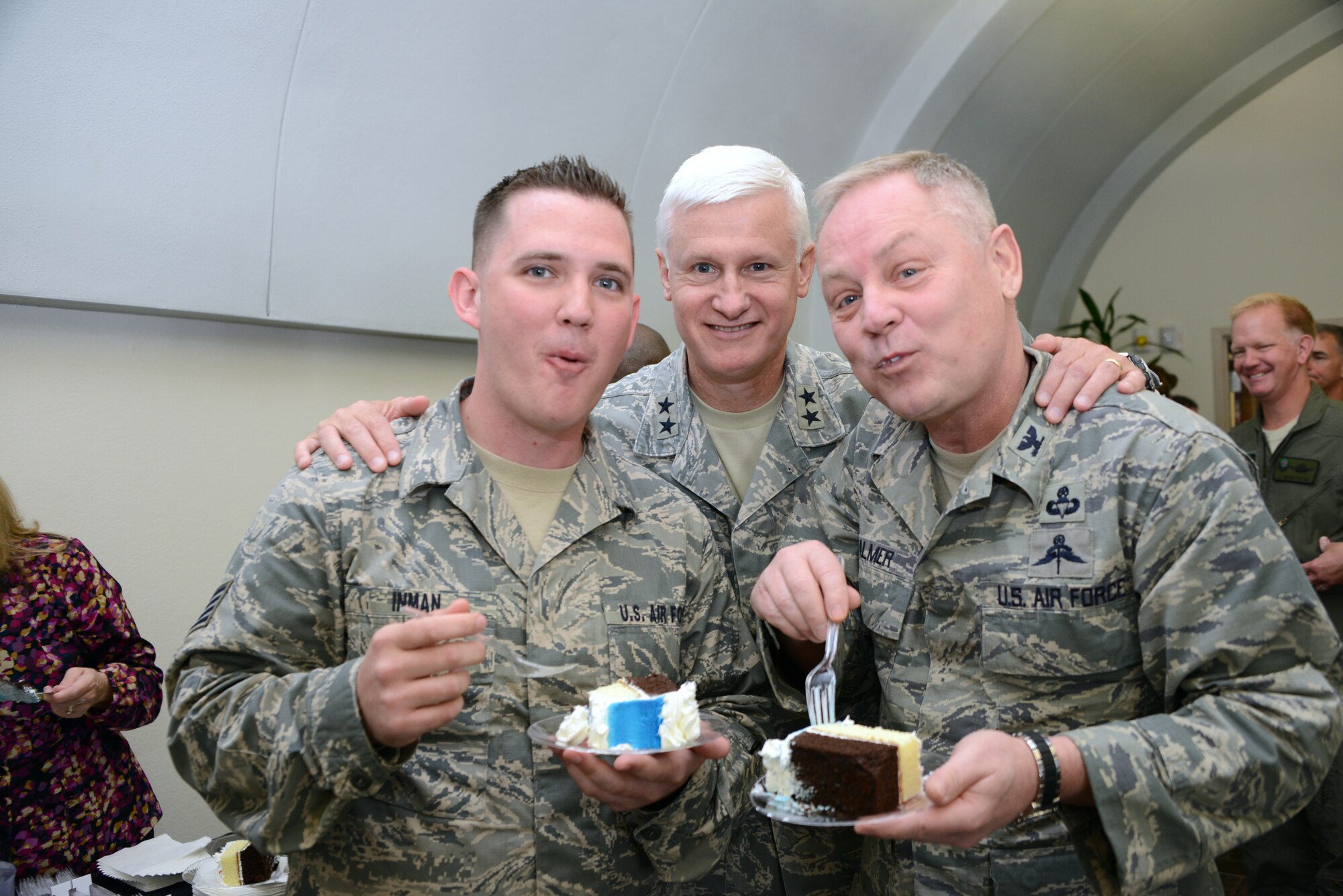 Staff Sgt. Michael Inman, Col. Glenn Palmer and Maj. Gen. Norman Brozenick celebrate the Air Force Special Operations Command's 24th Birthday on May 22, 2014. (U.S. Air Force photo by SSgt Erica Horner)