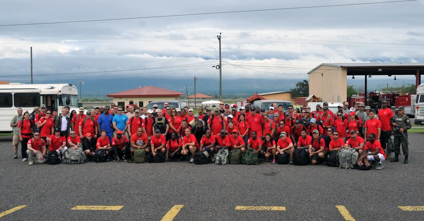 More than 120 members of Joint Task Force-Bravo, with the support of Joint Task Force-Bravo's Joint Security Forces and the Honduran military, completed a volunteer seven mile round trip hike to deliver 2,500 pounds of food and supplies to families in need in the mountain village of El Tamarindo outside Comayagua, Honduras, May 17, 2014.  The effort was part of the 54th Joint Task Force-Bravo Chapel Hike, a venerable tradition during which Task Force members donate money to purchase food and supplies and then carry those supplies on a hike through the mountains to deliver them to local, underserviced communities.  (Photo by Ana Fonseca)
