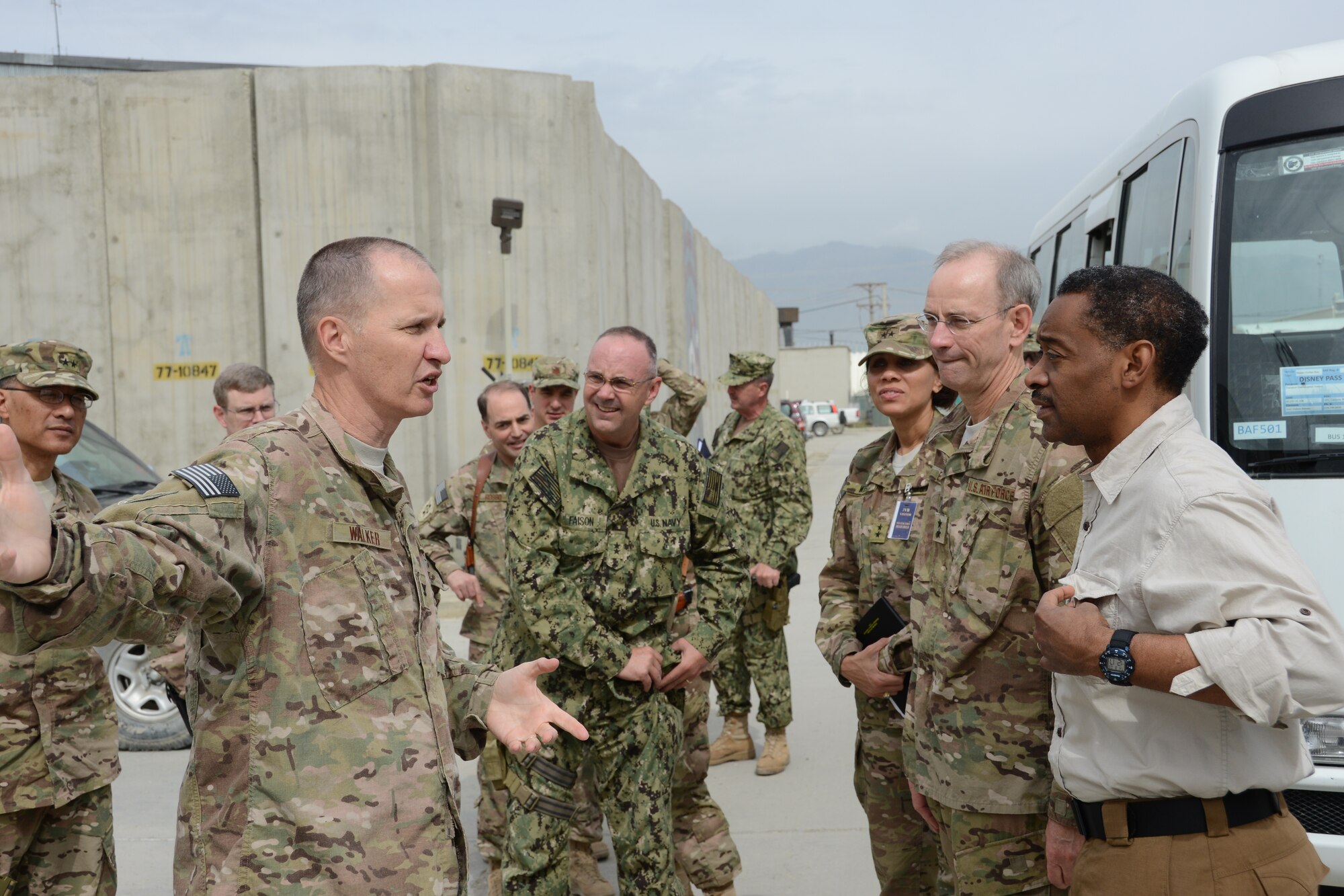 Col. Gary Walker, commander, 455th Air Expeditionary Medical Group, Bagram Airfield, leads the visiting joint team, from left, Army Maj. Gen. Joseph Caravalho Jr.; Rear Adm. Forrest Faison III, Navy Deputy Surgeon General; Maj. Gen. Nadja West, Joint Staff Surgeon to the Chairman of the Joint Chiefs of Staff; Maj. Gen. Mark Ediger, Deputy Air Force Surgeon General; and Assistant Secretary of Defense for Health Affairs, Dr. Jonathan Woodson during their visit to Bagram Airfield in May.  The team visited several medical facilities during their tour of the AOR May 3-10 to talk with front-line medical teams and observe medical operations.   