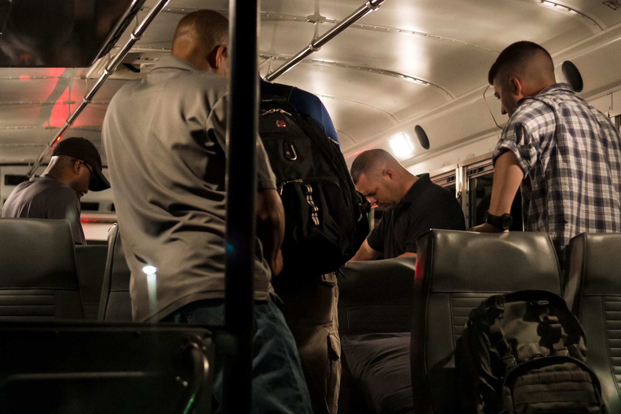 Members of the 307th Security Forces Squadron pray for safe travels prior to leaving for a deployment to Jordan in support of Eager Lion, May 19, 2014, Barksdale Air Force Base, La. Roughly 6,000 U.S. troops will participate in Eager Lion, which is an exercise involving scenarios ranging from training for a humanitarian assistance to practicing integrated air and missile defense. (U.S. Air Force photo by Master Sgt. Greg Steele/Released)