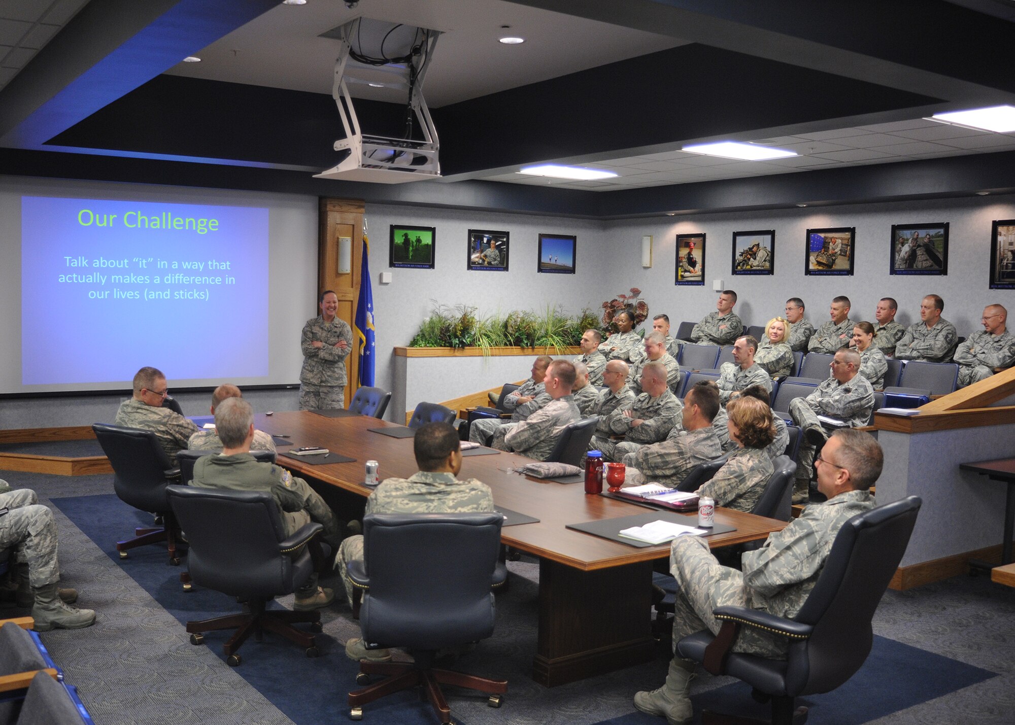1st Lt. Esther Willett, a speaker during the Developing Leaders of Character brief, has her audience cross their arms as part of a demonstration to point out that each person is different. Willett and Col. (ret) Greg Tate spoke to members of Team Malmstrom three times May 19 to help each develop better leaders through personal development. (U.S. Air Force photo/Senior Airman Cortney Paxton) 