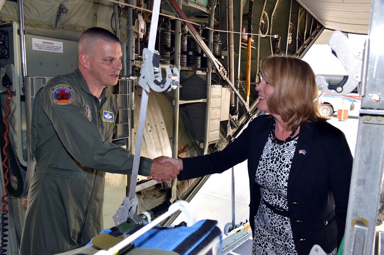 Secretary of the Air Force Deborah Lee James shakes hands with Senior Master Sgt. Tony Staut, 36th Aeromedical Evacuation Squadron, during James' tour of a 440th Airlift Wing C-130H Hercules aircraft on May 19. James received mission briefings from Pope commanders, toured facilities, had lunch with Airmen and conducted an "all call" with Pope Airmen during her one-day visit. (U.S. Air Force photo/Marvin Krause)