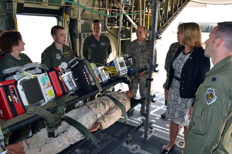 Secretary of the Air Force Deborah Lee James receives an aeromedical evacuation briefing from Staff Sgt. Ksana Bialick, 43rd Aeromedical Evacuation Squadron, during James' tour of a 440th Airlift Wing C-130H Hercules aircraft on May 19. James received mission briefings from Pope commanders, toured facilities, had lunch with Airmen and conducted an "all call" with Pope Airmen during her one-day visit. (U.S. Air Force photo/Marvin Krause)