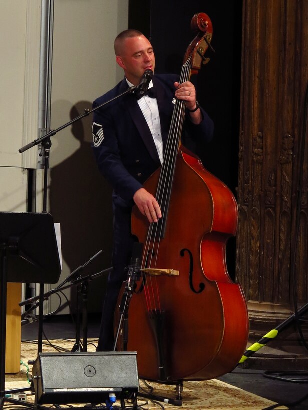 Singing “Galway Girl” and playing the double bass, Master Sgt. Eric Sullivan thrills the audience with his performance. Sullivan hails from Wilson, N.C., and his Air Force career began in 2000. (U.S. Air Force photo by Technical Sgt. Mandi Harper/released)