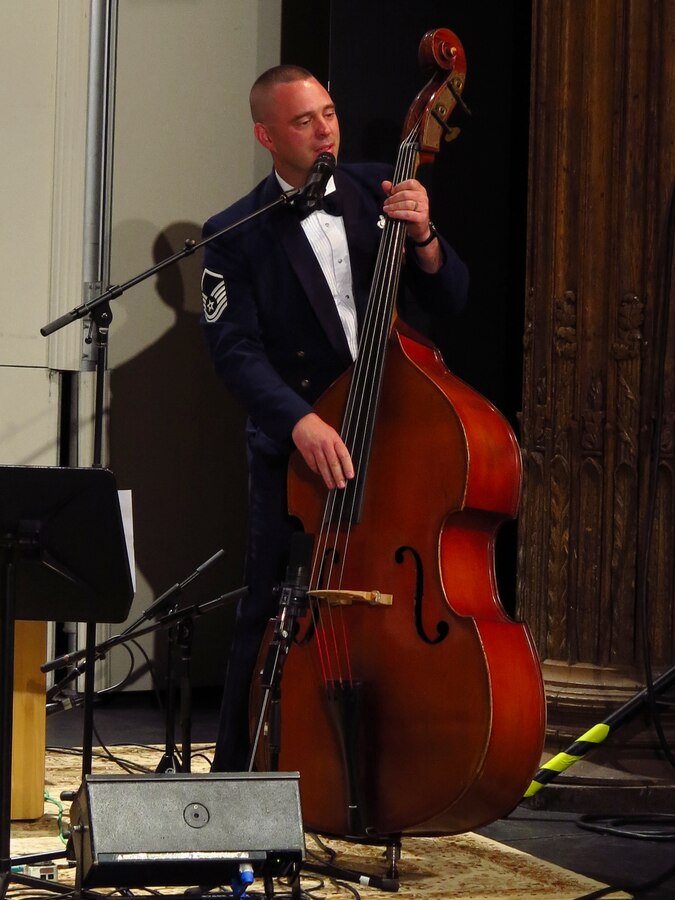Singing “Galway Girl” and playing the double bass, Master Sgt. Eric Sullivan thrills the audience with his performance. Sullivan hails from Wilson, N.C., and his Air Force career began in 2000. (U.S. Air Force photo by Technical Sgt. Mandi Harper/released)