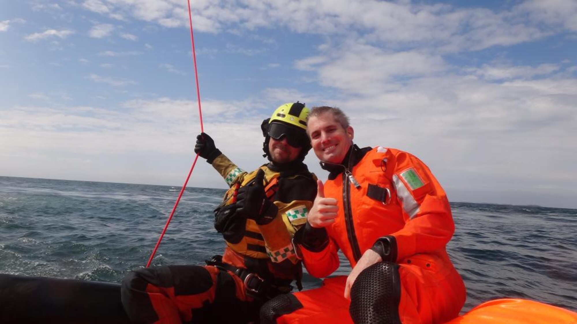 Maj. Kevin Catron, right, 426th Air Base Squadron Staff Judge Advocate, poses for a photo with a Royal Norwegian Air Force pararescueman during an exercise in the North Sea May 13, 2014. Catron and three other Airmen assisted the RNAF 330th Rescue Squadron in a certification exercise for their personnel. (Courtesy photo/Released)
