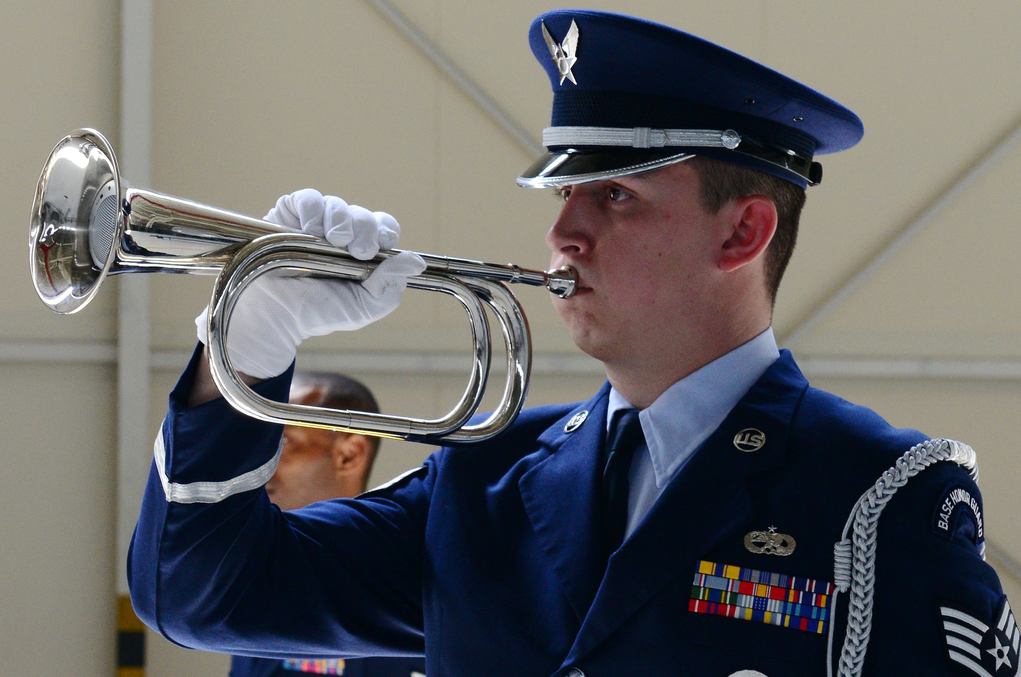 Staff Sgt. Cody Stapp, 31st Fighter Wing Honor Guard member, plays taps during a memorial service at Aviano Air Base, Italy, May 22, 2014. Master Sgt. John Colpoys, 31st Maintenance Squadron transient alert technician, passed away in a motorcycle mishap, May 14. (U.S. Air Force photo/Airman 1st Class Ryan Conroy)