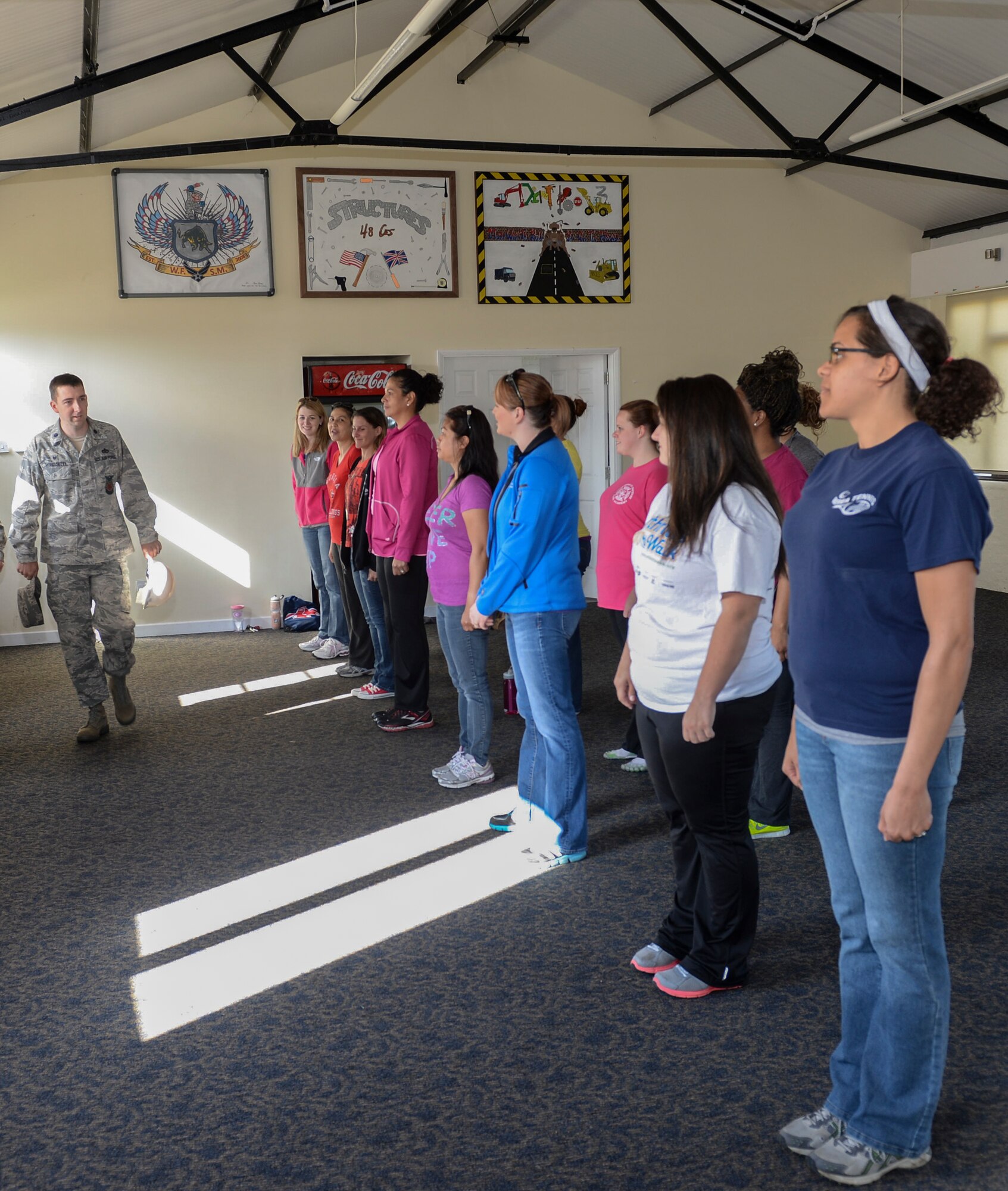 Lt. Col. Gregory Morissette, 48th Civil Engineer Squadron commander, briefs spouses on events they will participate in during Take Your Spouse to Work Day on Royal Air Force Lakenheath, England, May 21, 2014. Morissette created the event last year to give 48th CES spouses a better understanding of what their Airmen do at work. (U.S. Air Force photo by Airman 1st Class Nigel Sandridge/Released)