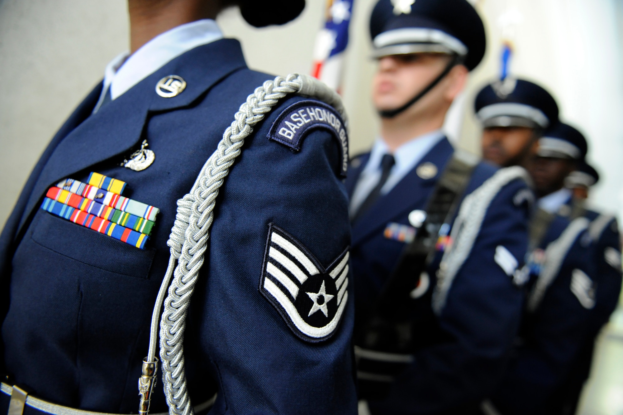 Members of the Kadena Air Base Honor Guard prepare to present the U.S., Japanese and Air Force flags during a retirement ceremony on Kadena Air Base, Japan, May 16, 2014. The honor guard is an all-volunteer duty that allows Airmen to show dignity and respect to service members and the nation. (U.S. Air Force photo by Senior Airman Maeson L. Elleman)