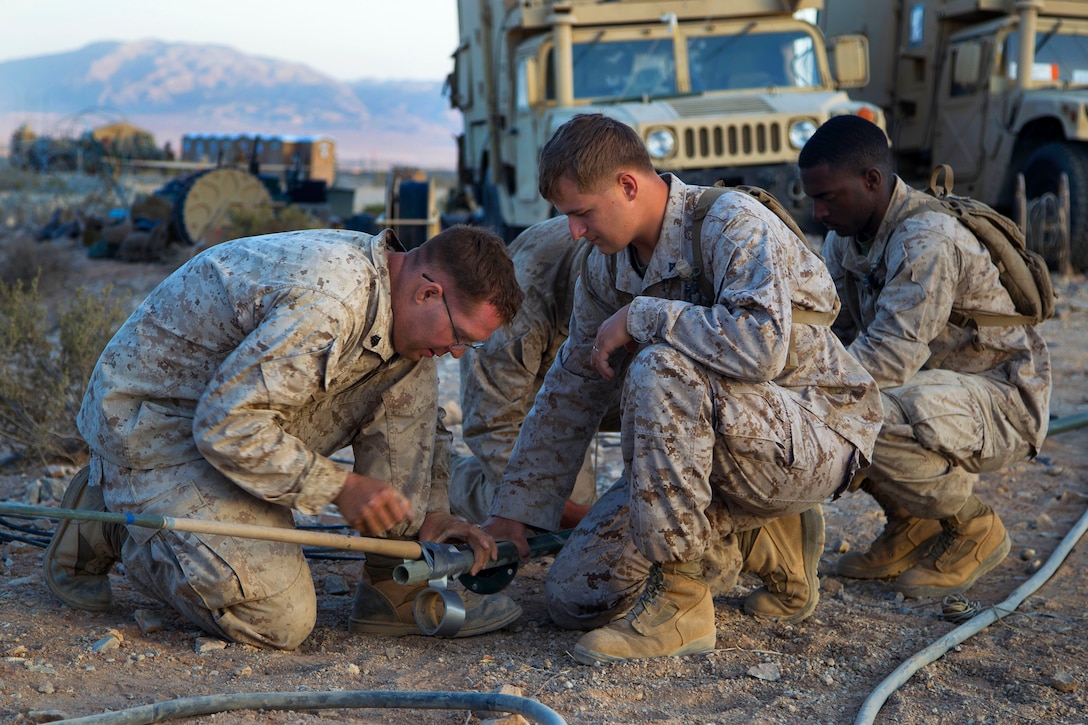 Marines setup a field expedient antenna during Exercise Desert Scimitar 2014 on Marine Corps Air Ground Combat Center Twentynine Palms, Calif., May 12, 2014. The Marines are assigned to Air Support Squadron 3, Marine Air Control Group 38, 3rd Marine Aircraft Wing.