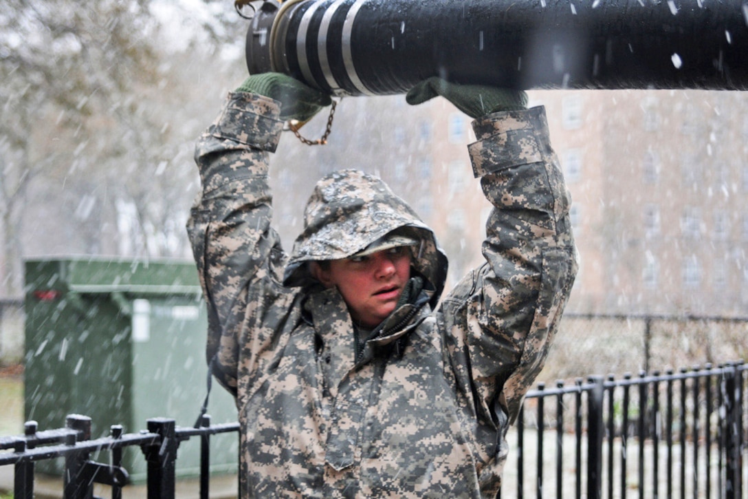 Army Sgt. Kimberly Boyce helps unload hoses to help pump water out basements at a housing complex during Hurricane Sandy recovery efforts in Rockaway, N.Y., Nov. 7, 2012. Residents there have been without power since the hurricane hit the Northeast last week. Boyce's unit deployed into the area to support the Federal Emergency Management Agency, and state and local officials.  
