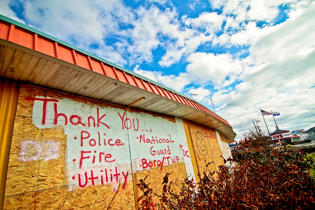 A sign by the entrance to Long Beach Island, N.J.,Nov. 6, 2012, thanks local first responders and the New Jersey National Guard for responding to the damage and flooding from Hurricane Sandy.  
