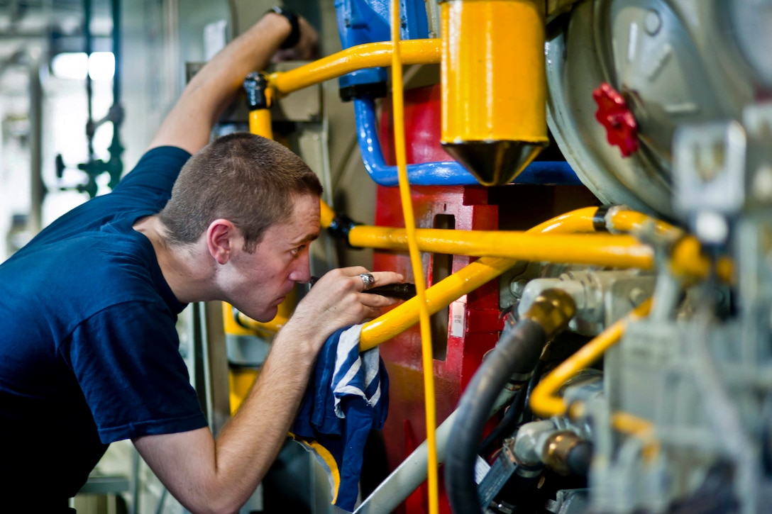 U.S. Navy Seaman Charles Wilson watches for the fly wheel alignment on an emergency diesel power generator aboard aircraft carrier USS John C. Stennis in the U.S. 5th Fleet area of responsibility, Nov. 6, 2012. The Stennis is conducting maritime security operations, theater security cooperation efforts and support missions for Operation Enduring Freedom. Wilson is an electrician's mate fireman.  
