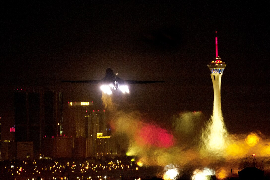 A B1-B Lancer aircraft takes off at night in the direction of the Las Vegas Strip during exercise Green Flag-West at Nellis Air Force Base, Nev., Oct. 30, 2012. The aircraft is assigned to the 34th Bomb Squadron at Ellsworth Air Force Base, S.D.  
