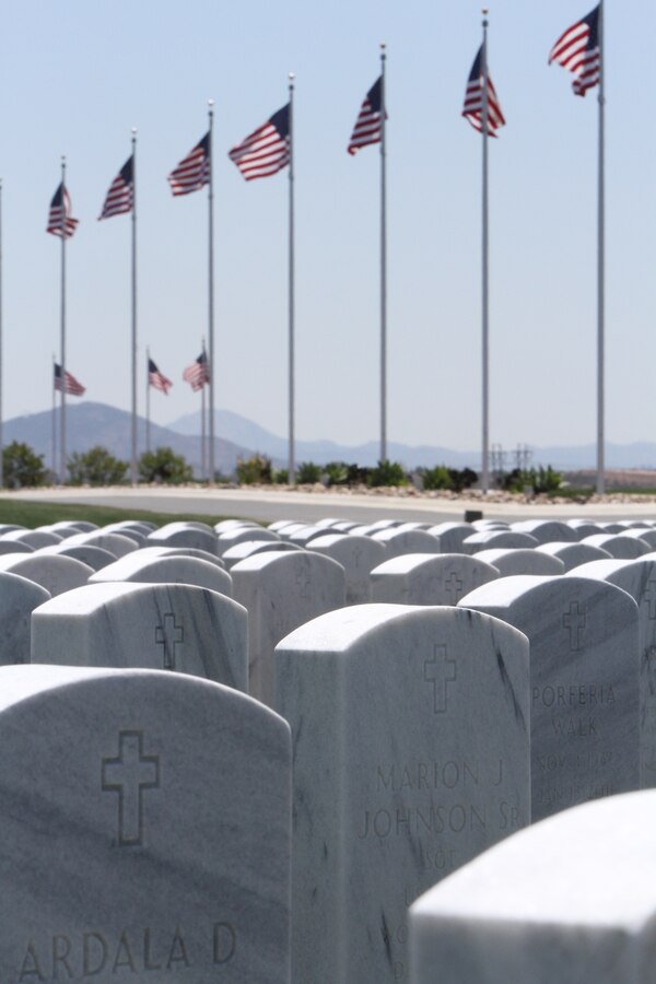 American flags wave in the distance over headstones at the Miramar National Cemetery in San Diego, May 15. The cemetery serves as an annex to the Fort Rosecrans National Cemetery and was dedicated January 2010. 