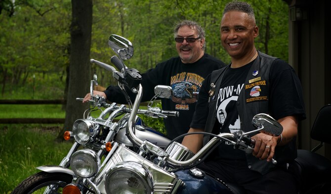 Retired Master Sgt. Rob Wilkins, front, and retired Marine 1st Sgt. Walt Sides pose for a portrait May 15, 2014, at Sides' farm outside Leesburg,Va. Wilkins and Sides are directors of Rolling Thunder, the annual motorcycle demonstration run through Washington, D.C., which attempts to raise awareness of military veterans, prisoners of war and missing in action personnel. (U.S. Air Force photo/Senior Airman Alexander W. Riedel)