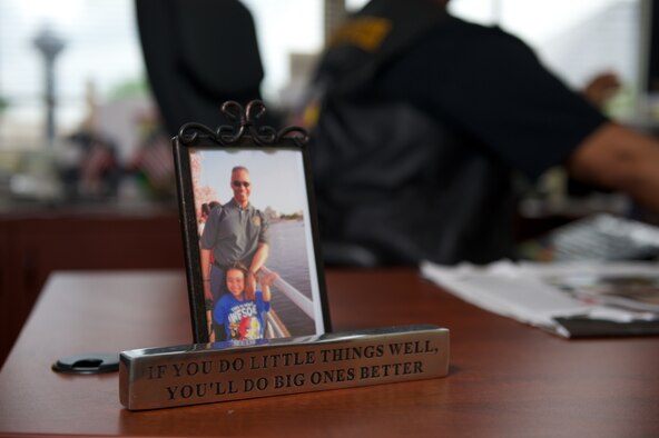 A photo of retired Master Sgt. Rob Wilkins and his son, Robert, is displayed in his office May 15, 2014, in Leesburg, Va. Wilkins is an organizer and member of the board of directors for Rolling Thunder, the annual motorcycle demonstration run that aims to raise awareness of prisoners of war and missing in action personnel of the nation's wars. (U.S. Air Force photo/Senior Airman Alexander W. Riedel)
