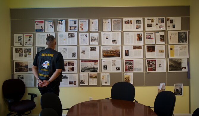 Retired Master Sgt. Rob Wilkins reviews a new magazine layout May 15, 2014, at his office in Leesburg, Va. Wilkins, a member of the board of directors for Rolling Thunder, the annual motorcycle demonstration run, is the director for audience development at the publishing house that specializes in military history magazines. (U.S. Air Force photo/Senior Airman Alexander W. Riedel)