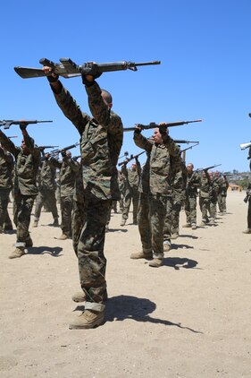 Recruits of Company I, 3rd Recruit Training Battalion, perform bayonet techniques during a Marine Corps Martial Arts Program class aboard Marine Corps Recruit Depot San Diego Calif., May 14. Recruits were taught to perform horizontal and vertical butt strokes, vertical and horizontal slashes, disrupt and offensive and defensive weapon maneuvers.