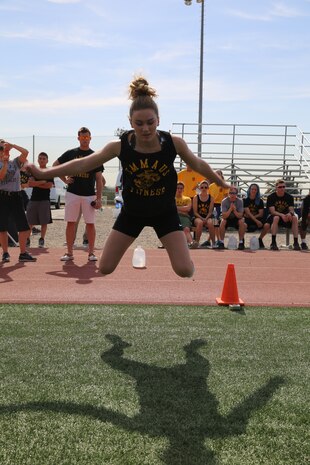 Shaelyn Weida performs the long jump during The National High School Physical Fitness Championships aboard Marine Corps Recruit Depot San Diego, May 16-17. The event consisted of each team performing sit-ups, push-ups, five long jumps, pulls ups and a shuttle run.