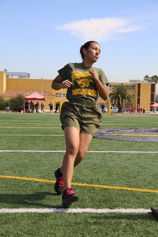 Viviana G. Leon sprints down the field in the shuttle run during The National High School Physical Fitness Championships aboard Marine Corps Recruit Depot San Diego, May 16-17. The shuttle run was the last step of the event for all of the competitors.