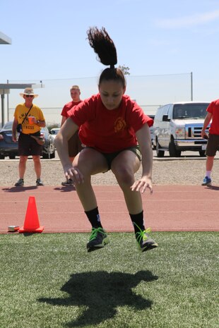 Lauren Hess conducts a long jump during The National High School Physical Fitness Championships aboard Marine Corps Recruit Depot San Diego, May 16-17. To earn a spot at the National High School Physical Fitness Championships, high schools have to attain a qualifying score at state level.