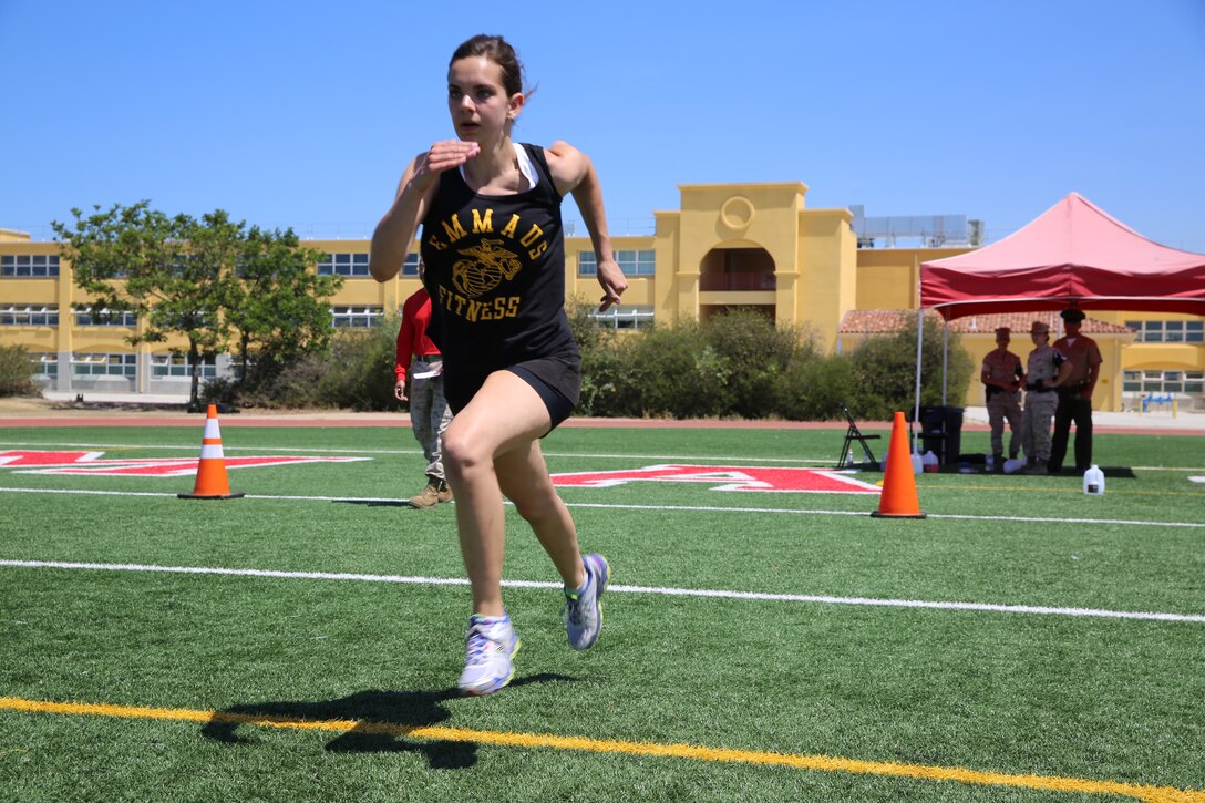 Kristen S. Brag sprints down the field during the shuttle run portion of The National High School Physical Fitness Championships aboard Marine Corps Recruit Depot San Diego, May 16-17. To earn a spot at the National High School Physical Fitness Championships, high schools have to attain a qualifying score at state level.