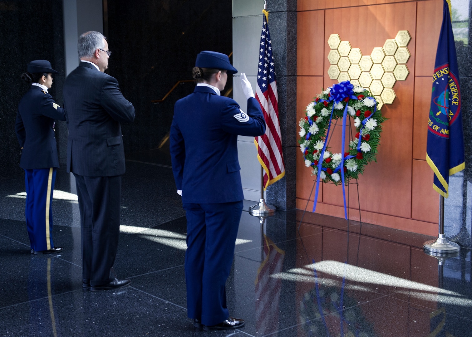 DIA’s Deputy Director David Shedd and members of the DIA Color Guard salute following a Memorial Day wreath laying at the agency’s Patriots Memorial.