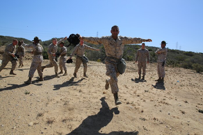 Pfc. Mohammed N. Yahya, Platoon 2154, Company G, 2nd Recruit Training Battalion, breathes fresh air after completing the Confidence Chamber on May 12. He joined the United States Marine Corps after leaving Iraq and coming to America in search of a better life. Yahya was born and raised in Baghdad, and lived there during the initial invasion of Operation Iraqi Freedom in 2003.
