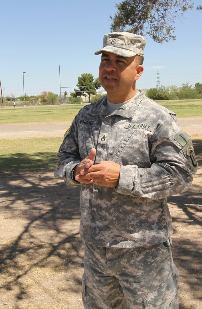 Arizona Army National Guard Staff Sgt. Marcos Moreno, 1/285th Regional Training Institute, explains his plan to rename Sunnyside Park in Tucson in honor of Command Sgt. Maj. Martin Barreras, who died during military operations in Afghanistan. Barreras was a 1983 graduate of Sunnyside High School located next to the park.
