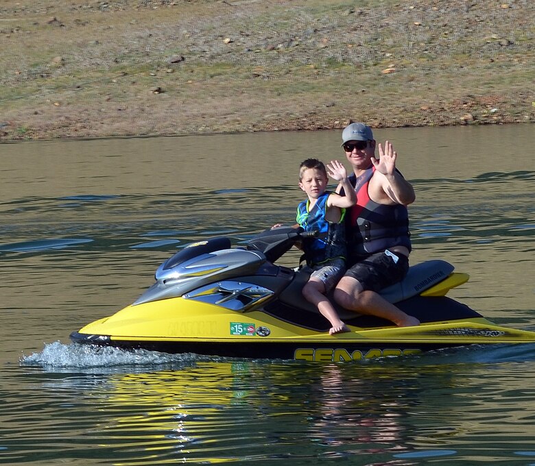 Safe-boating buddies head out on their personal watercraft at Pine Flat Lake near Piedra, Calif., May 3, 2014. 