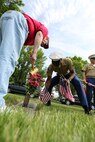 Mr. Charlie Barnes and Gunnery Sgt. Timothy Ussery place a flag at a fallen servicemembers grave May 21 at Mt. Moriah and Freeman Funeral Home in Kansas City, Mo. The Simpson Hoggat Marine Corps league will also host an event for family membersr of the fallen Monday May 26. 