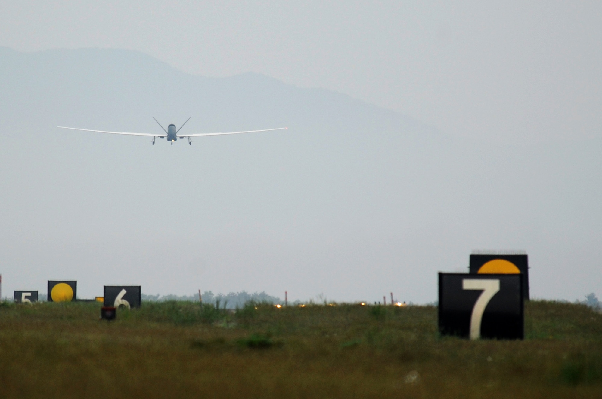 The RQ-4 Global Hawk approaches Misawa Air Base marking the first historic landing in Japanese territory, May 24, 2014. The remotely piloted system is temporarily assigned here from Andersen AFB, Guam, during the months of May through October. (U.S. Air Force photo/Tech. Sgt. April Quintanilla)