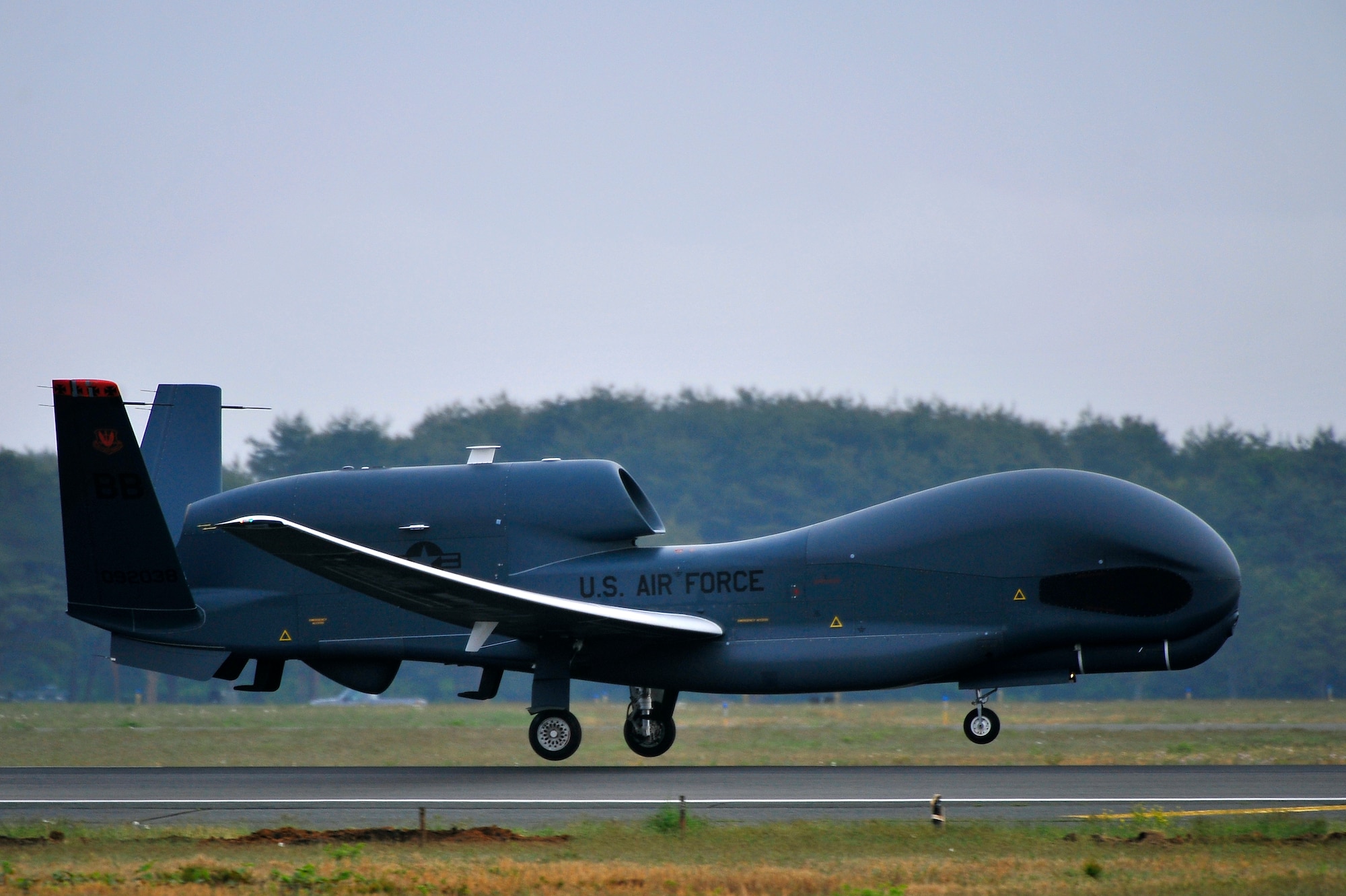 An RQ-4 Global Hawk from Andersen Air Force Base, Guam lands at Misawa Air Base, Japan, May 24, 2014. The remotely piloted system supports U.S. intelligence, surveillance, and reconnaissance missions and contingency operations throughout the Pacific theater. The Global Hawk will be temporarily assigned to Misawa AB until October. (U.S. Air Force photo/Staff Sgt. Nathan Lipscomb)