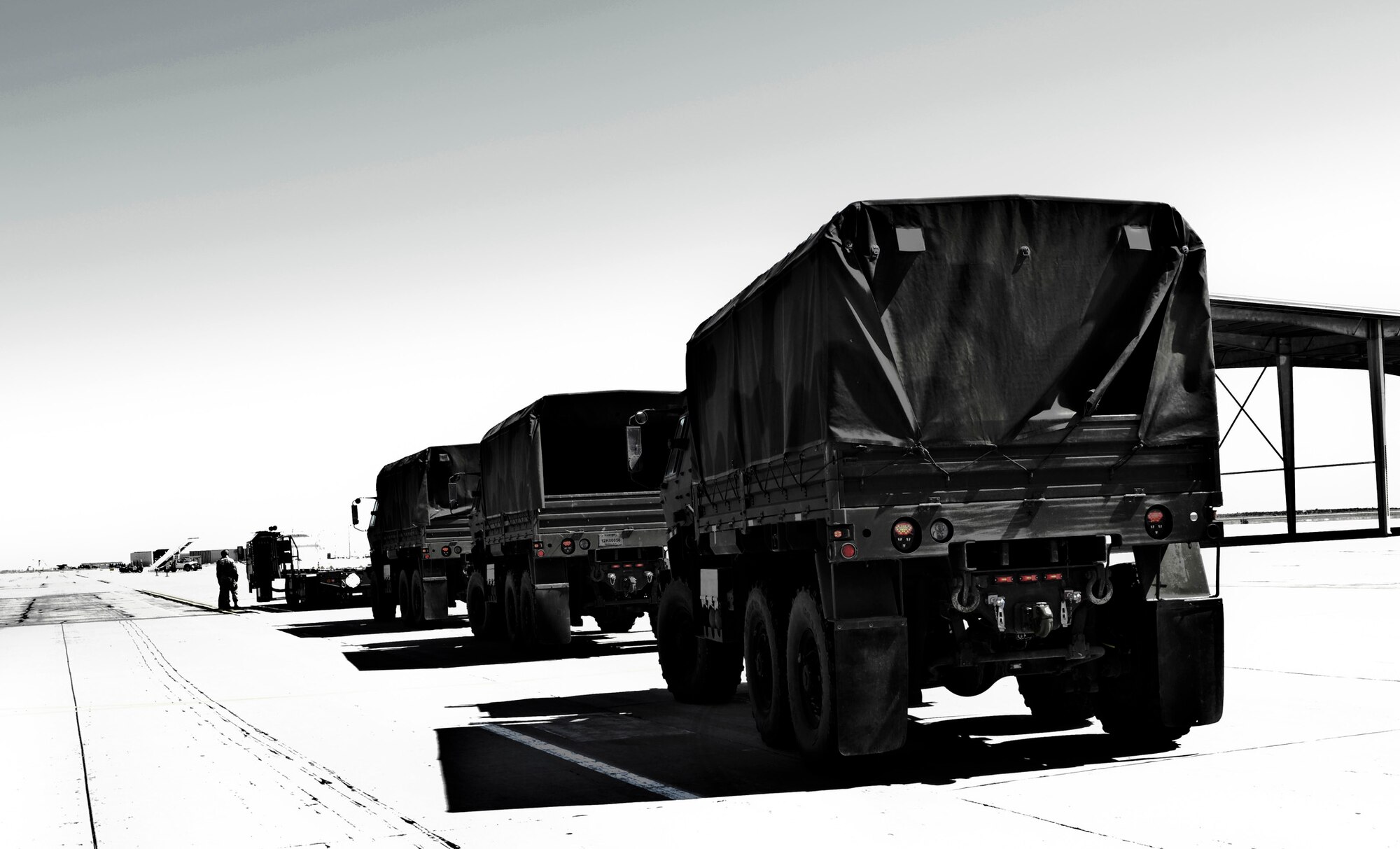 A convoy of 726th Air Control Squadron vehicles moves onto the flightline at Mountain Home Air Force Base as more than 100 ‘Hardrock’ 726th ACS Airmen return from deployment to various locations in Afghanistan and Southwest Asia May 23, 2014. The convoy was simple for Hardrock Airmen, who routinely convoy at Saylor Creek and Juniper Butte ranges, serving as moving targets for F-15E and F-15SG Strike Eagles, and other joint or coalition aircraft to ‘attack.’ (U.S. Air Force photo by Master Sgt. Kevin Wallace/RELEASED)