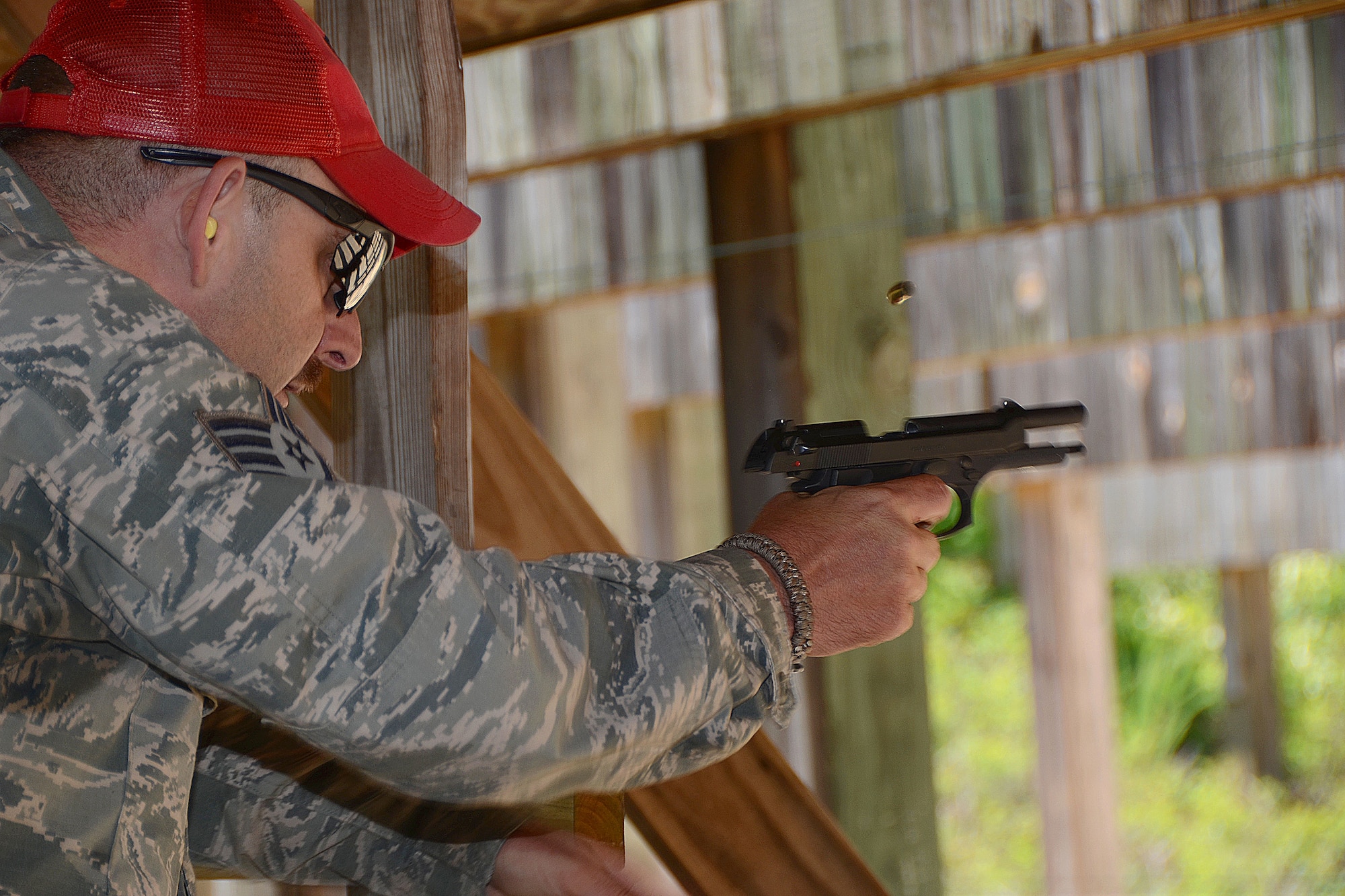 Staff Sgt. Kenvyn Lewis, assigned to the 169th Security Forces Squadron, instructs fellow South Carolina Air National Guard members during annual weapons qualification training at McEntire Joint National Guard Base, S.C May 20, 2014. Weapons qualification is an essential component of Airmen readiness and safety at home and abroad.  (U.S. Air National Guard photo by Airman 1st Class Ashleigh S. Pavelek/Released)