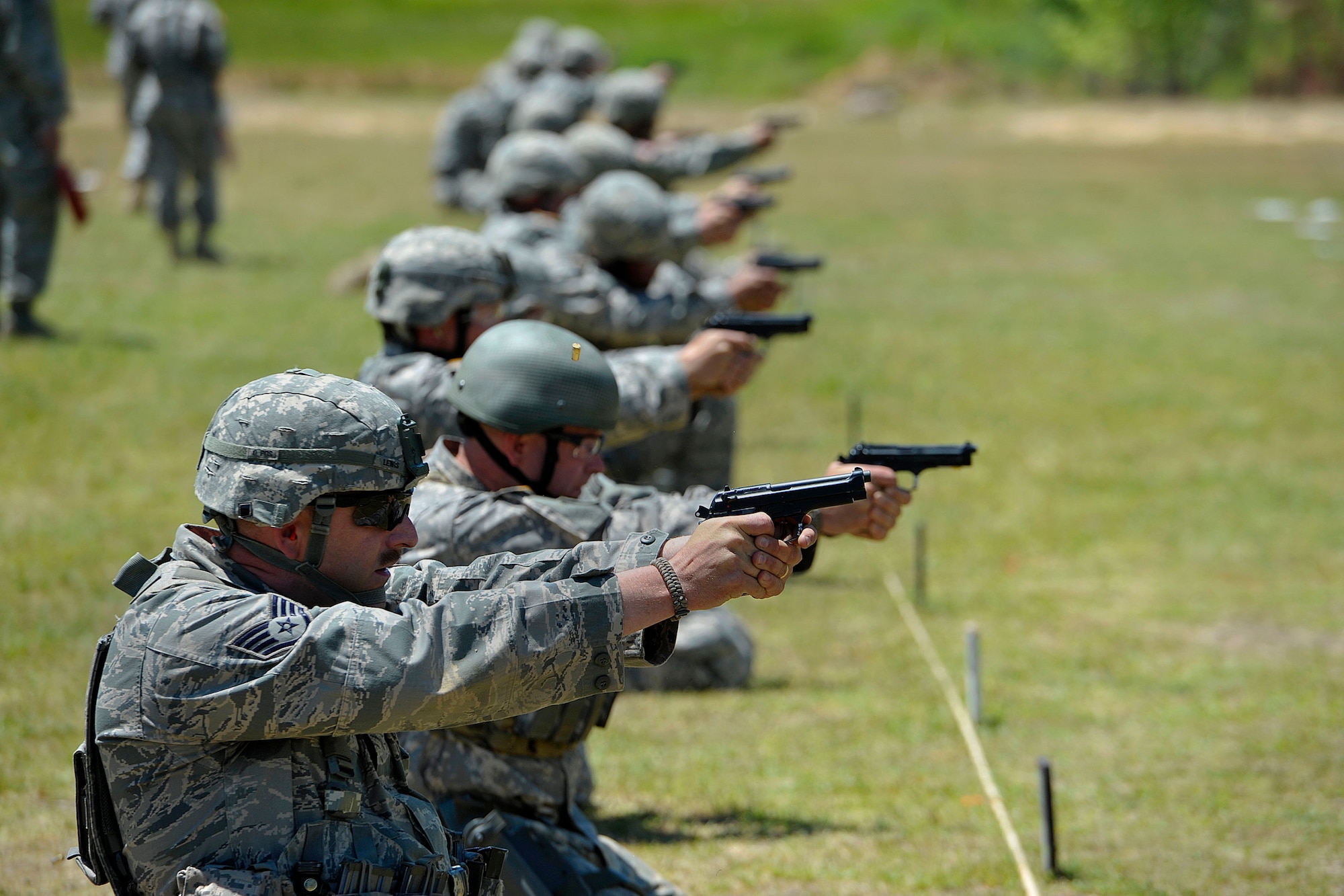 Staff Sgt. Kenvyn Lewis, assigned to the 169th Security Forces Squadron of the South Carolina National Guard at McEntire Joint National Guard Base, S.C., competes in the annual Winston P. Wilson Championships pistol category at Camp Joseph T. Robinson, North Little Rock, Ark., May 9, 2014.  (Courtesy photo by NGB-PA/Released)