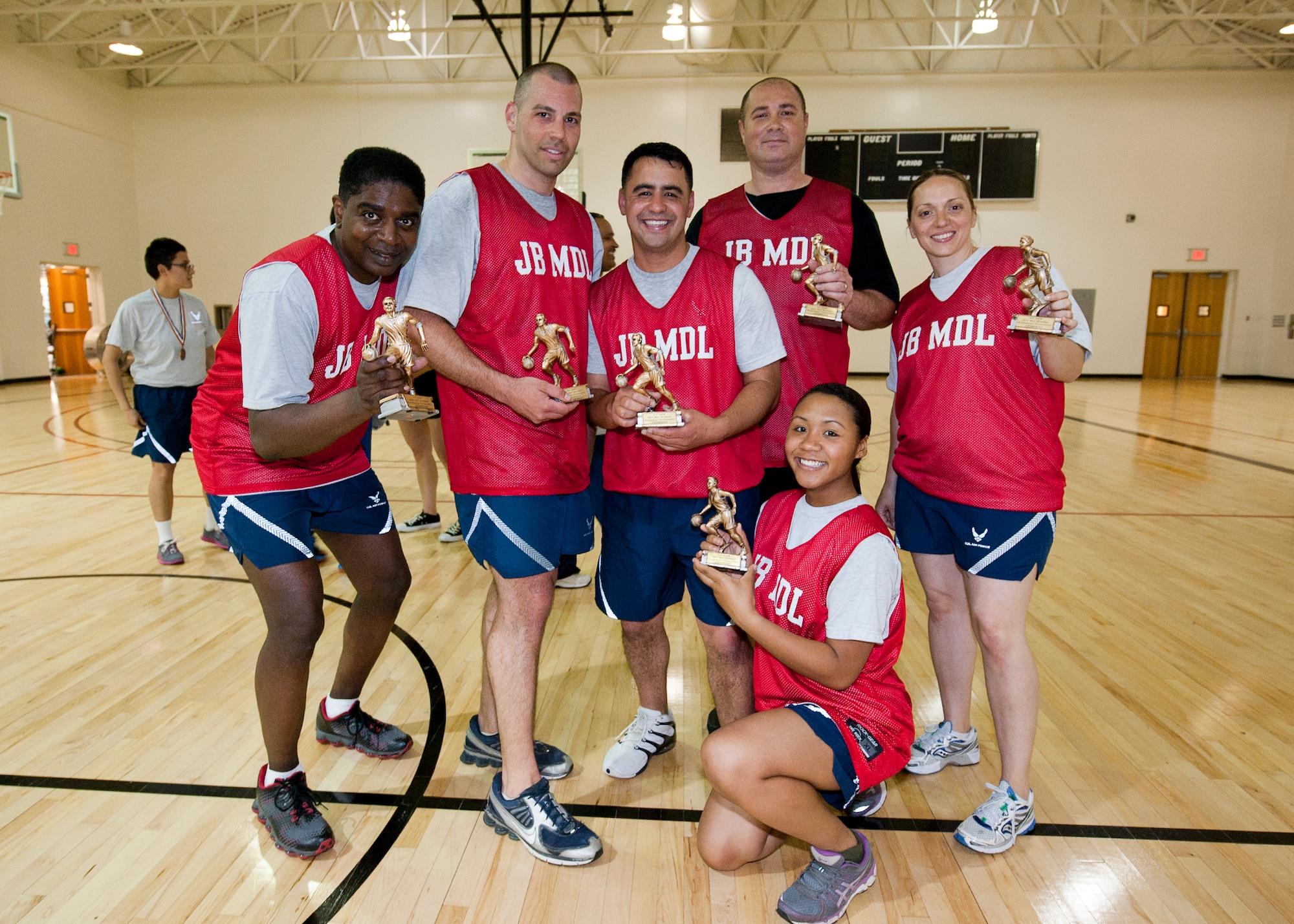 The 514th Civil Engineer Squadron, fire department's basketball team, (Team Fire) pose after winning the 514th Air Mobility Wing basketball tournament in a three-overtime shootout against 514th CES , May 17, here. (U.S. Air Force photo/Christian DeLuca)
