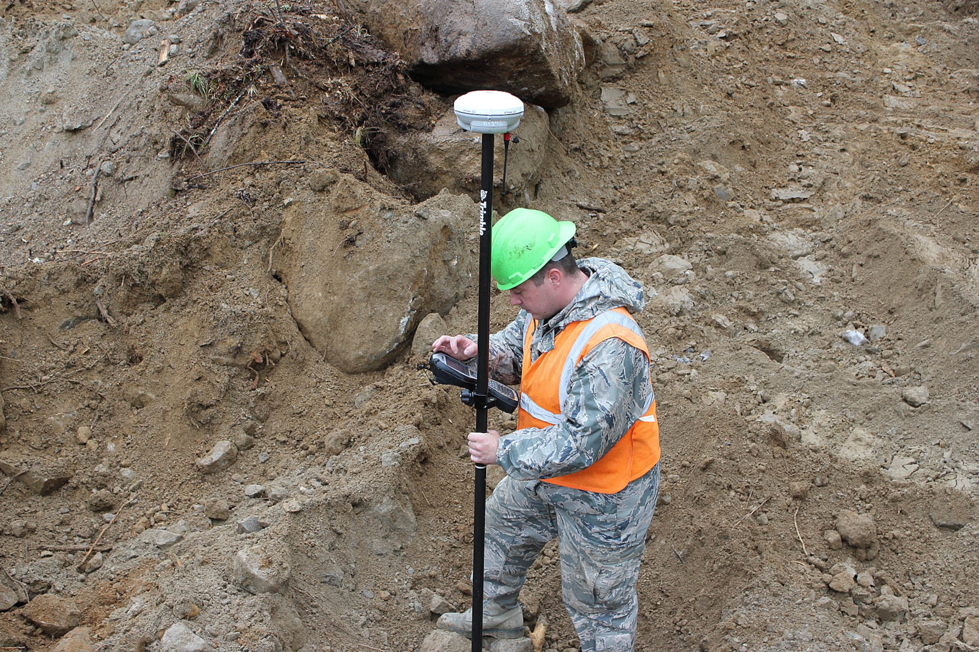140523-Z-VA676-019 Staff Sgt.  Luke Lavigne prepares to take a site reading while working while working at Camp Hinds Boy Scout camp, Raymond, Maine, May 22, 2014. Lavigne, an engineering assistant, is among about three dozen Airmen from the 127th Civil Engineer Squadron, Michigan Air National Guard, who are working on various construction projects at the camp during an Innovative Readiness Training mission, which allows military personnel to get training in various tasks and a community organization, in this case the Boy Scouts, to benefit from the work. About two dozen Marine Reservists from the 6th Engineer Support Battalion are also working on the project, as well as several Airmen from the Rhode Island Air National Guard. (U.S. Air National Guard photo by Technical Sgt. Dan Heaton)