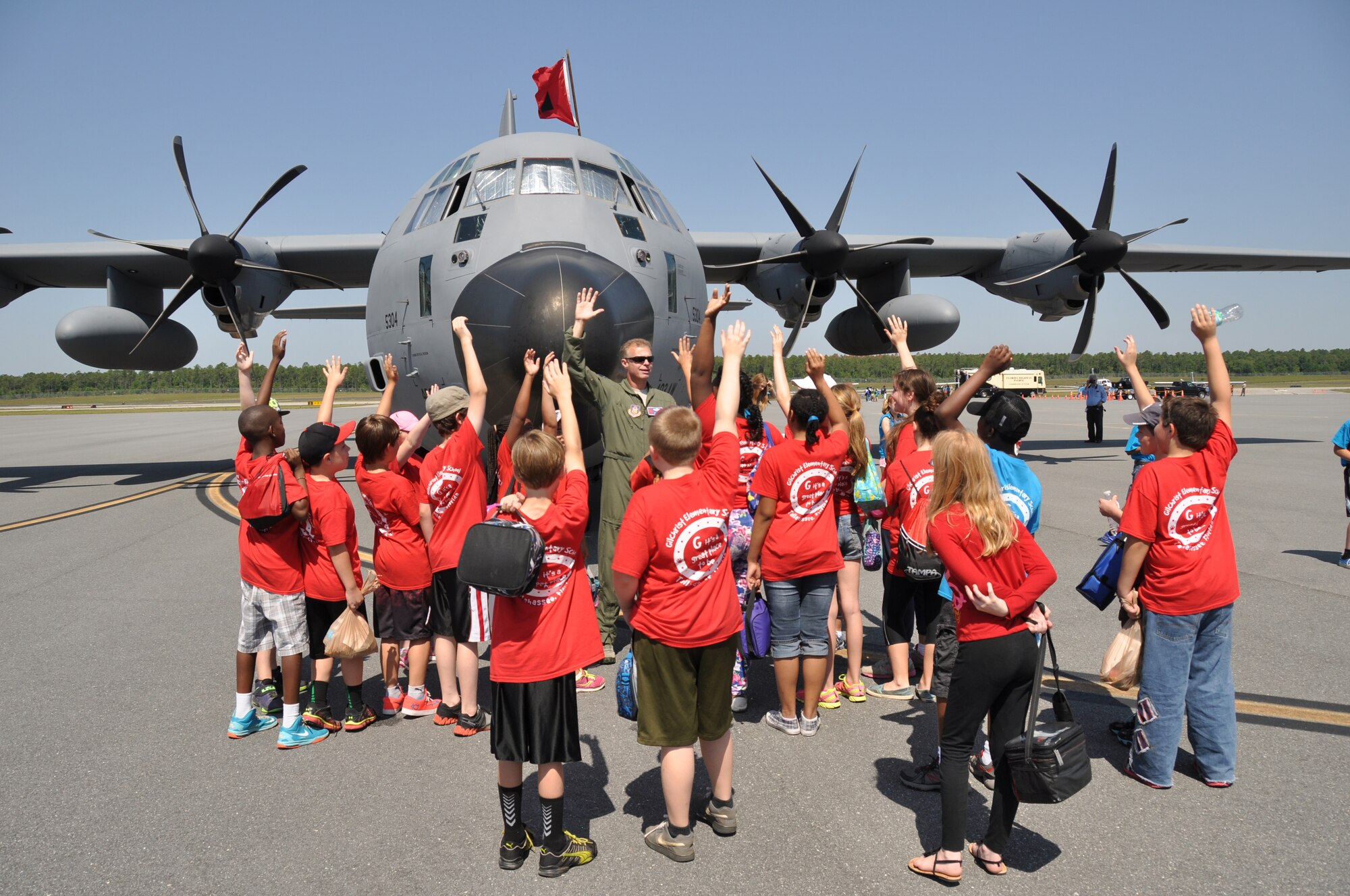 Lt. Col. Keith Gibson, director of operations for the 53rd Weather Reconnaissance Squadron interacts with students from Gilchrist Elementary School during the Tallahassee Hurricane Awareness Tour May 22 at the Tallahassee Regional Airport.
