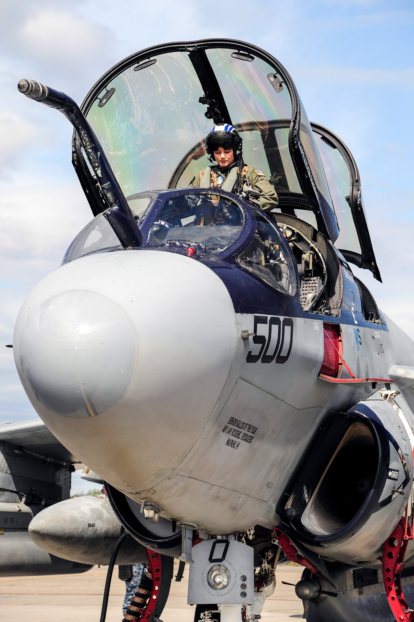 U.S. Navy Lt. Candice Nunley, an EA-6B Prowler pilot from the Electronic Attack Squadron 142, Naval Air Station Whidbey Island, Oak Harbor, Wash., enters the cockpit in preparation for a training sortie during RED FLAG-Alaska 14-1 May 21, 2014, Eielson Air Force Base, Alaska. RF-A is a Pacific Air Forces-directed field-training exercise designed to train U.S. and coalition forces in a realistic combat environment. (U.S. Air Force photo by Senior Airman Zachary Perras/Released)