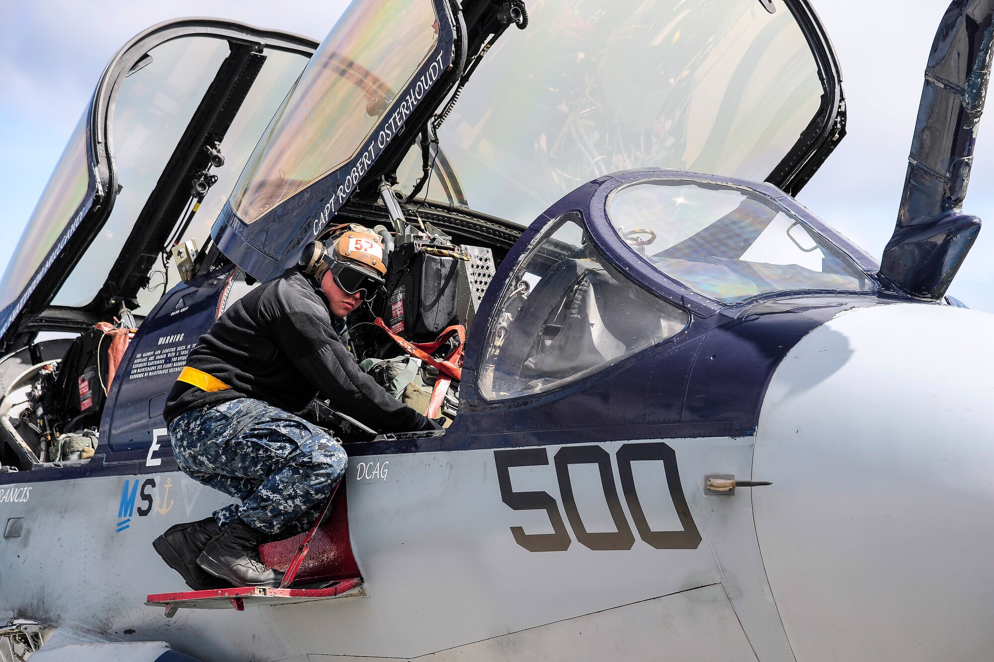 A U.S. Navy EA-6B Prowler crew chief from the Electronic Attack Squadron 142, Naval Air Station Whidbey Island, Oak Harbor, Wash., performs preflight procedures during RED FLAG-Alaska 14-1 May 22, 2014, Eielson Air Force Base, Alaska. The Prowler is a twin-engine, mid-wing electronic warfare aircraft derived from the A-6 Intruder. (U.S. Air Force photo by Senior Airman Zachary Perras/Released)