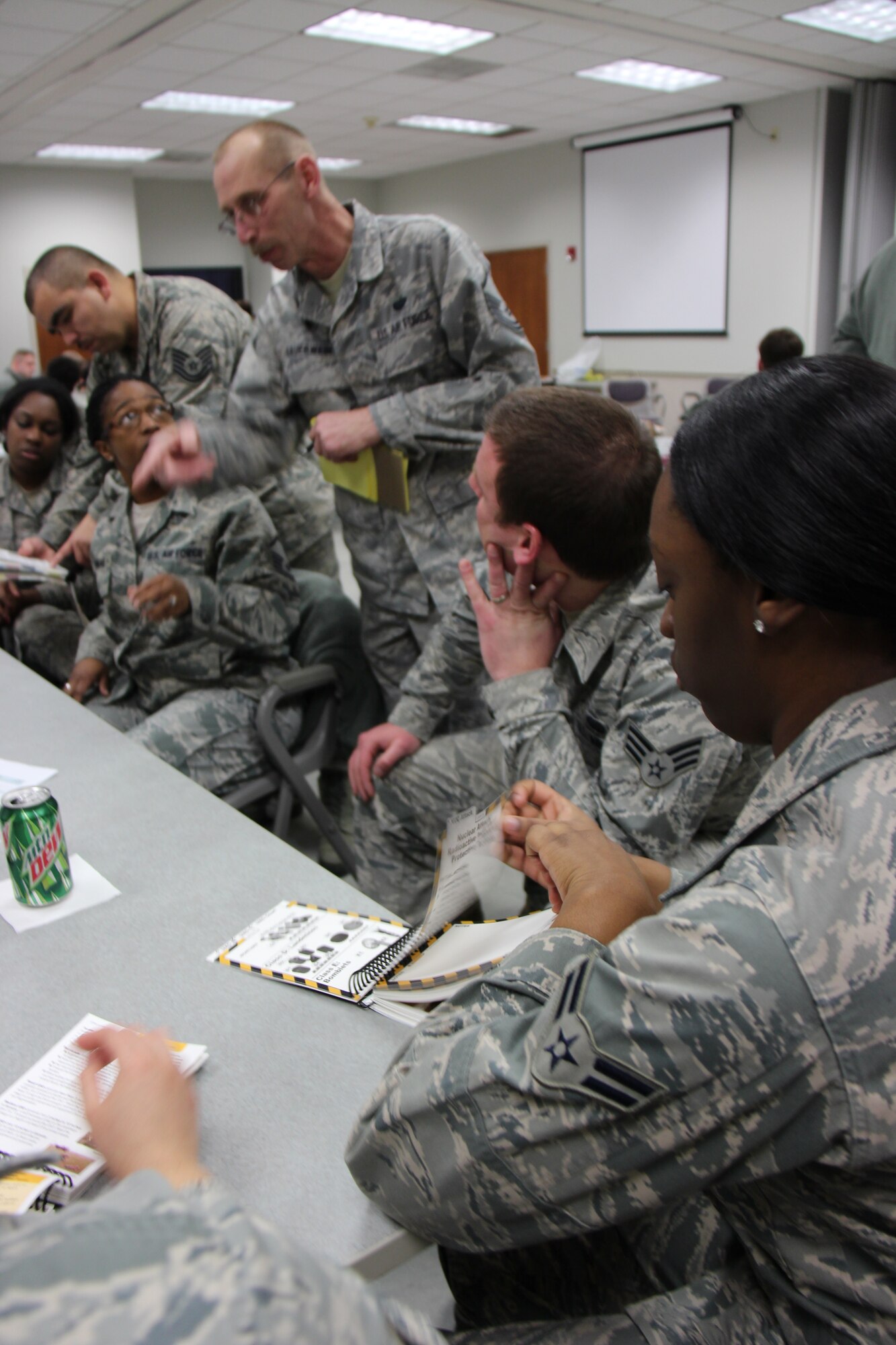 932nd Mission Support Group members take a look at the Airman's manual during a recent training event.  The unit is located at Scott Air Force Base.   (U.S. Air Force photo/Maj. Stan Paregien)