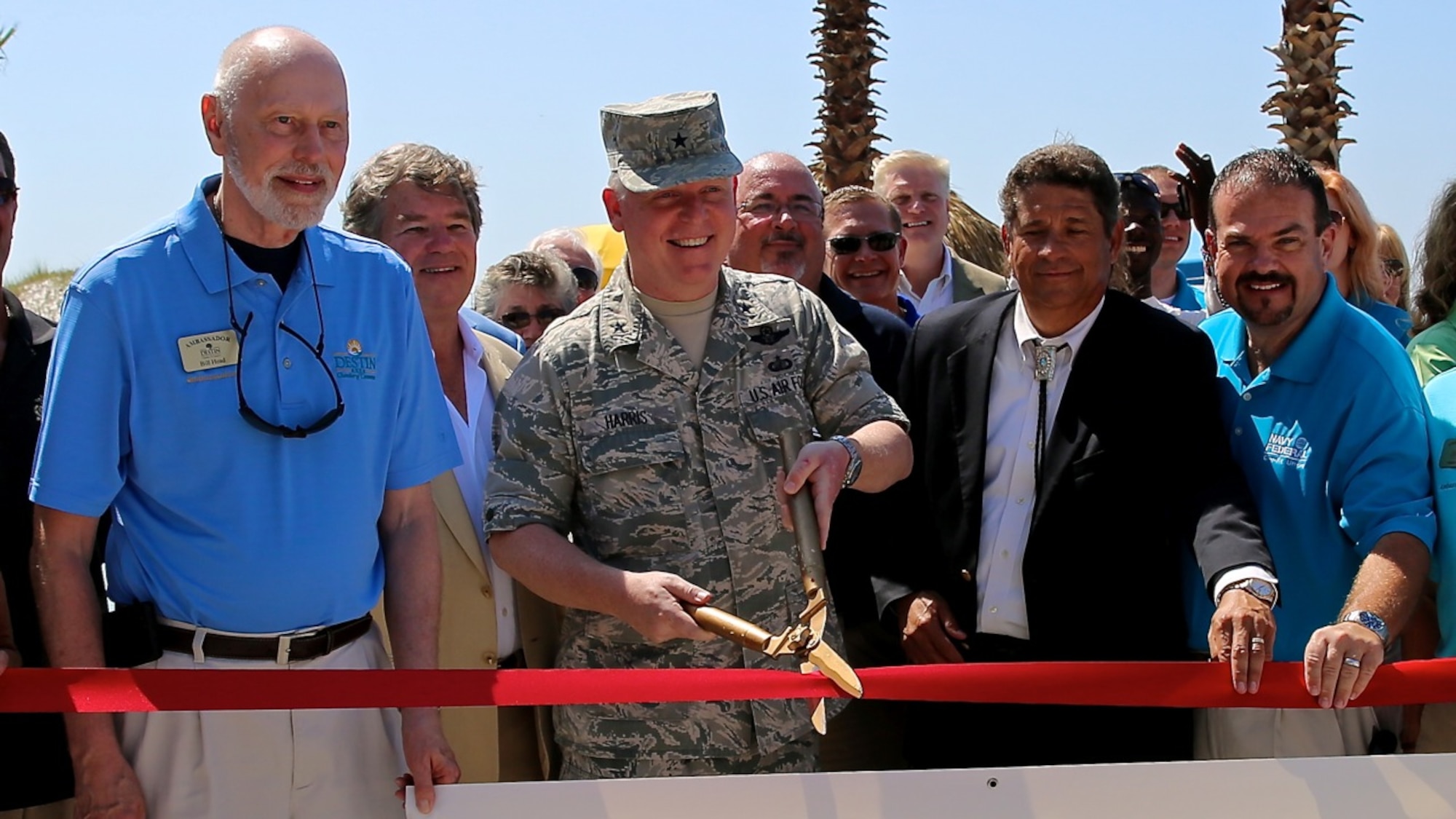EGLIN AIR FORCE BASE, Fla. – Brig. Gen. David Harris, 96th Test Wing commander, participates in the opening of the Emerald Breeze Hotel on Okaloosa Island. The hotel is the third of three enhanced use lease projects at Eglin Air Force Base. Rent for the use of Air Force land provides payment-in-kind funds to accomplish facility projects that would otherwise not be funded. (U.S. Air Force photo/Eddie Green /Released)